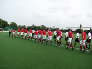 hockey match mens walking onto field