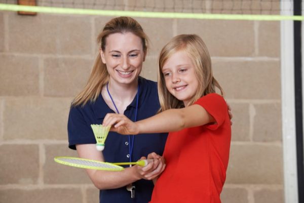 Teacher and pupil in PE lesson